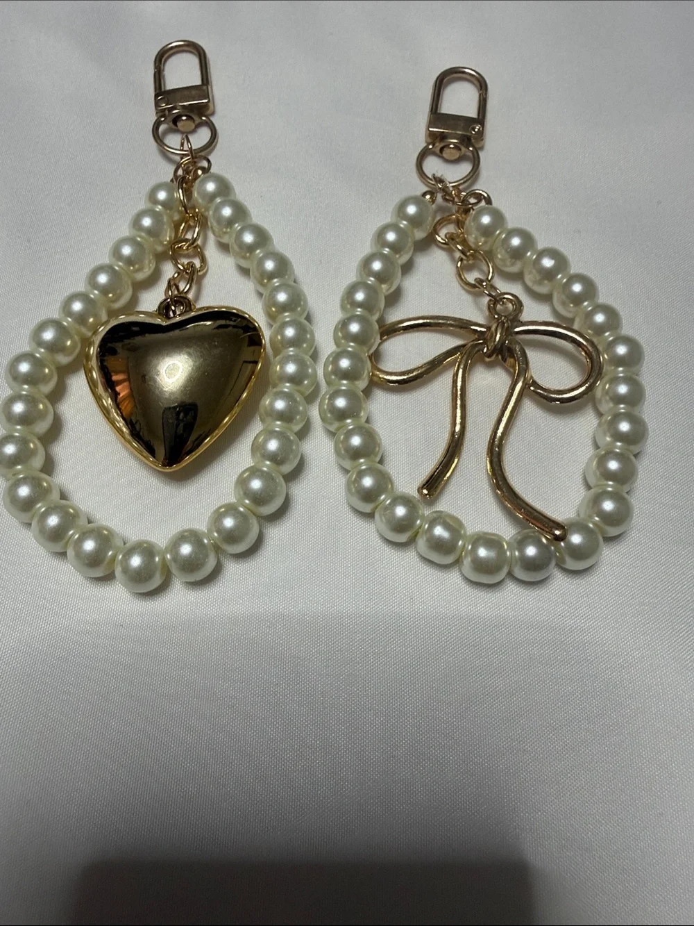 Pearl Loop Keychain Pair with Gold Heart and Bow Charms